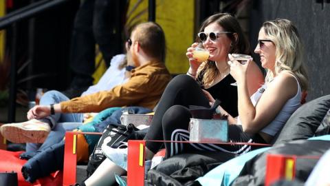 People drinking in a pub