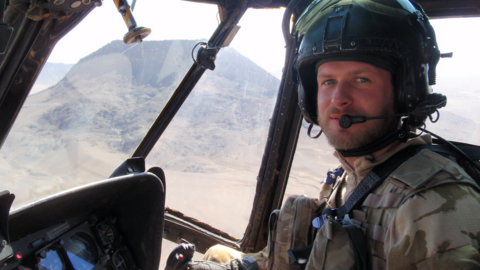 Charlie Peschardt piloting a helicopter