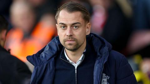 Tonda Eckert looks on after a game 