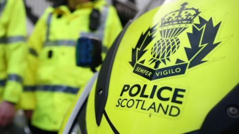 Police Scotland vehicle and officers.