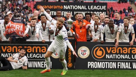 Bromley players celebrate after beating Solihull Moors on penalties in the National League final at Wembley in May