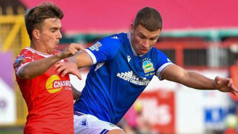 Shelbourne's James Norris in action against Linfield's Ethan McGee during the first leg at Tolka Park