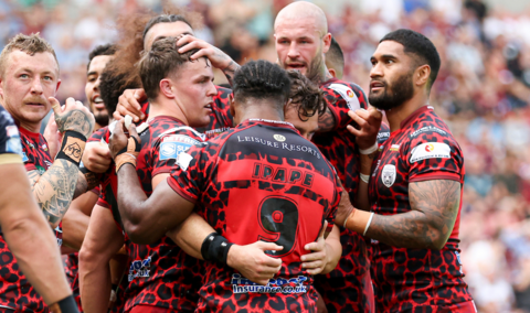 Leigh players celebrate a try