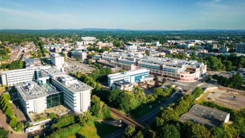 An aerial view of Crawley in West Sussex, showing the town centre and the surrounding countryside.