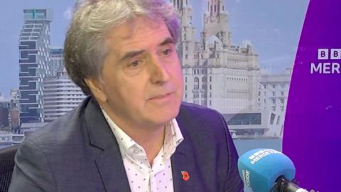Steve Rotheram sits in the BBC Radio Merseyside studio
