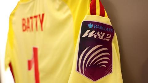 A badge that says 'Barclays WSL2' on the sleeve of an Emily Batty Nottingham Forest shirt