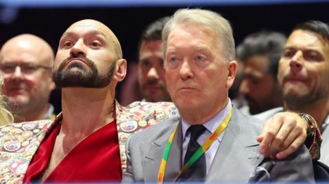 Tyson Fury has his arm around Frank Warren 