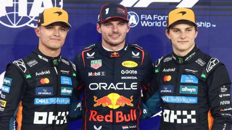 Lando Norris, Max Verstappen and Oscar Piastri pose for photographs after qualifying in Abu Dhabi
