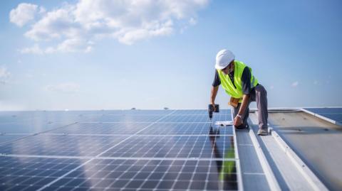 Generic image of solar panels on a commercial building