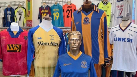 Five different coloured shirts can be seen, on top of headless mannequins. 