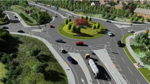 Artist's impression of a roundabout on the A1237, York's Outer Ring Road. A 4.6-mile section of the A1237 is due be turned into a dual carriageway as part of the improvements scheme. A fuel tanker is heading onto the roundabout which has red-leafed trees in the middle of it.