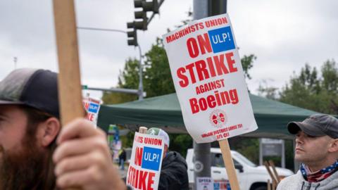 Workers picket outside a Boeing Co. facility during a strike in Everett, Washington, US, on Monday, Sept. 16, 2024. 