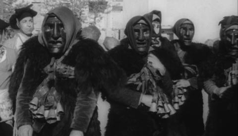 Mamuthones in Sardinia, wearing masks, fur capes, and bells.