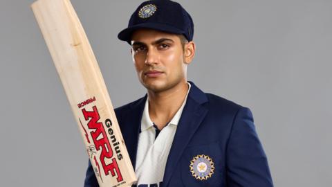 Shubman Gill poses with his newest Test bat, inscribed with his 'Prince' nickname