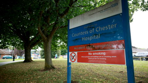Signage is seen outside an entrance to the Countess of Chester Hospital in Chester