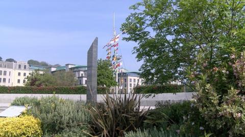 The Liberation Monument with buildings and the memorial mast behind