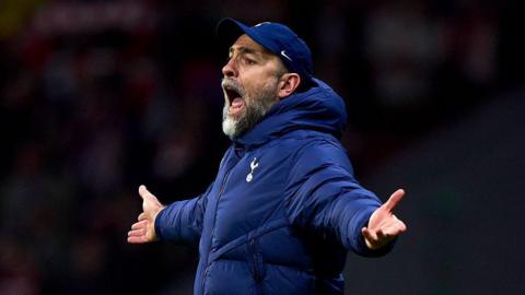 Igor Tudor stands with his arms outstretched