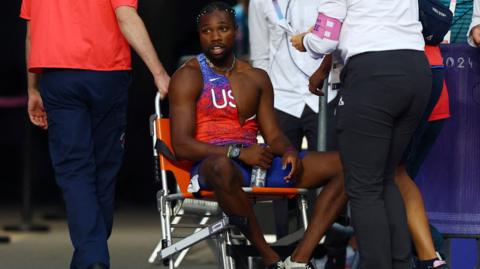 Noah Lyles in wheelchair