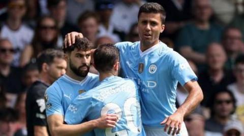 Manchester City players celebrate against Fulham