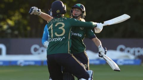 Ireland batters Rebecca Stokell and Alana Dalzell celebrate beating England