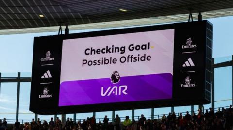 A VAR screen showing checking potential offside 