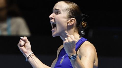 Ukraine's Elina Svitolina yells in celebration after winning her Billie Jean King Cup match against Spain's Paula Badosa