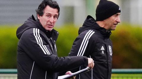 Unai Emery and Pako Ayestaran look on during an Aston Villa training session