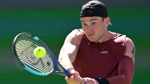 Jack Draper hits a backhand