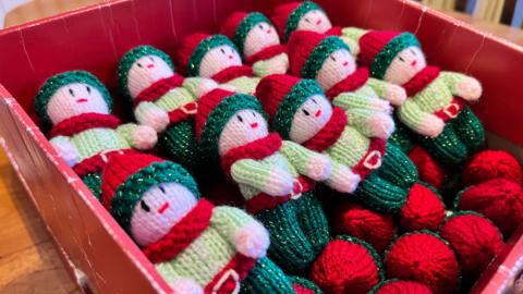 A box of knitted elves