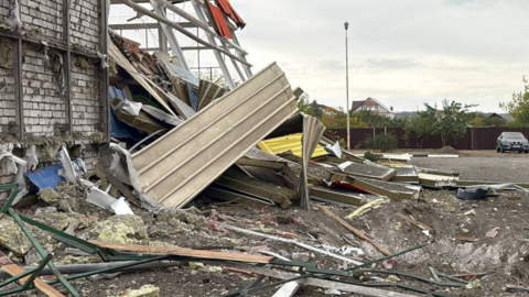 A crater next to a sports complex building destroyed by what local authorities called a recent Ukrainian missile attack in the course of Russia-Ukraine conflict, in the settlement of Maslova Pristan in the Belgorod Region, Russia October 8, 2025