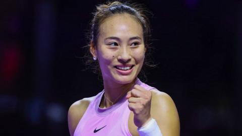 Zheng Qinwen celebrates victory over Jasmine Paolini at the WTA Finals