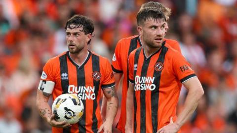 Dundee United's Will Ferry and Ryan Strain