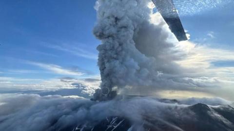 The Krasheninnikov Volcano spewing smoke and ash during an eruption.