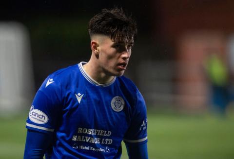 Max Johnston during his time at Queen of the South in the Dumfries side's blue kit