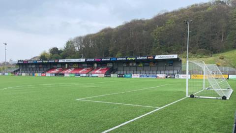 The main stand of the Scarborough Sports Village from pitch side - as well as a small dip in the six yard box of the football pitch where the damage is taken affect