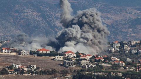 Smoke rises from the site of an Israeli airstrike that targeted the southern Lebanese village of Khiam on September 25, 2024. 