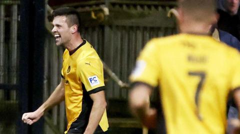 Adam Lecky celebrates