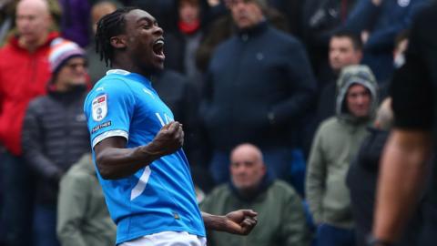 Isaac Olaofe of Stockport County celebrates