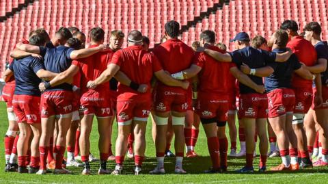 Scarlets players stand in a huddle ahead of their 32-19 win over Lions in Johannesburg.
