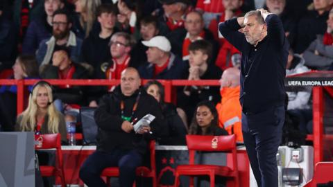 Ange Postecoglou has hands on his head as he watches Nottingham Forest slide to defeat