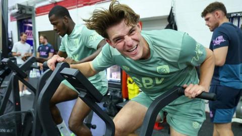 Bournemouth midfielder Alex Scott training on an exercise bike