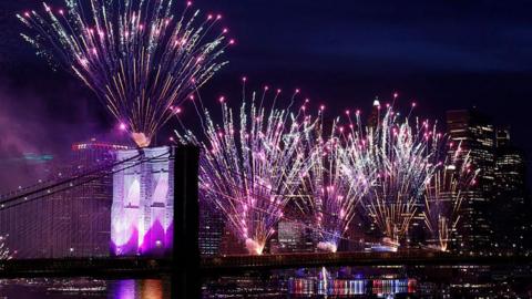 Fireworks light up the Brooklyn Bridge during the Macy's Fourth of July celebration in New York City.
