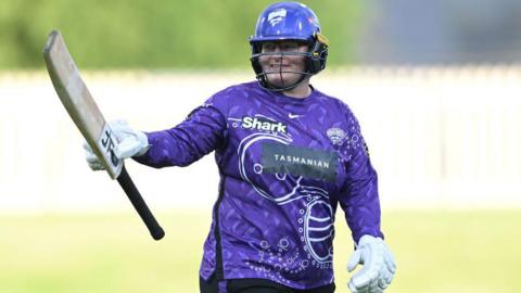 Lizelle Lee raises her bat for a century for Hobart Hurricanes