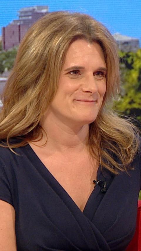 Woman smiling and looking off camera