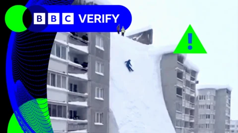 A screengrab from one video - made with AI - showing a huge snow drift collapsing in Russia's far east
