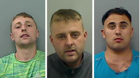 Lewis Thompson who has short blonde hair and is wearing a green t-shirt is looking at the camera in a police mugshot. Shaun Thompson who has short blonde hair and is wearing a grey zipped jacket. Jack Carlsson has dark hair and is wearing a blue t-shirt. 