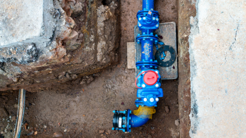 A blue pipe underground