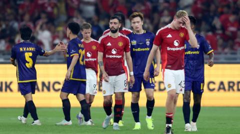 Manchester United players after their defeat in Malaysia 