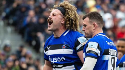 Alfie Barbeary (left) of Bath celebrates his sides fourth try