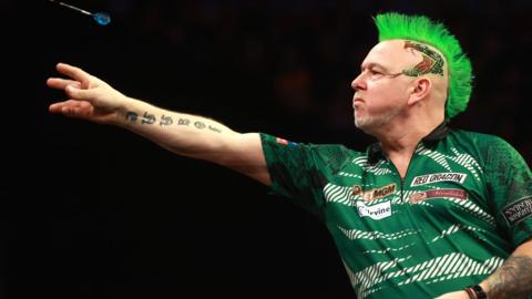 Peter Wright throws a dart